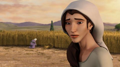 Ruth standing and looking at the viewer